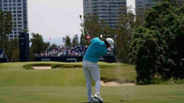 Brooks Koepka hits a shot during practice for the 2023 U.S. Open.
